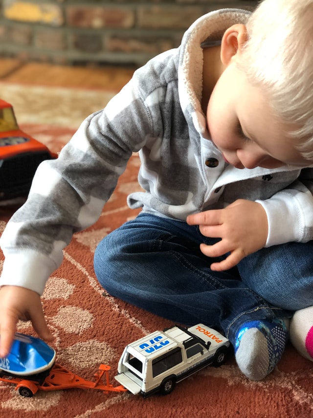 toddler-playing-child Toddler playing with toys